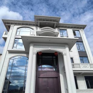 百色白麻别墅外墙干挂石材效果示例