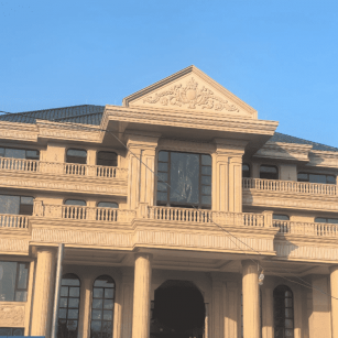 百色黄金麻别墅外墙干挂石材效果示例